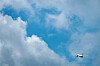 A flight flies over Gimpo International Airport on Friday. [YONHAP]