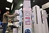 A shopper checks out an air conditioner at the Electro Mart inside the Emart Cheonggyecheon branch in Jung District, central Seoul, on May 21. Demand for seasonal appliances like air conditioners and dehumidifiers is rising as humid weather from frequent rain and early heat waves hit the country.[NEWS1]