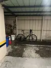 A covered space for bikes at the back of a parking garage at a motel in Cheongju, North Chungcheong on Sept. 28. [JIM BULLEY]