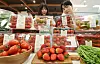 Models present a range of food items for Emart's spring sale at the hypermarket's Yongsan branch on March 13. [YONHAP]