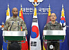 Col. Lee Sung-jun, right, the spokesperson for South Korea's Joint Chiefs of Staff, and U.S. Forces Korea spokesperson Col. Isaac L. Taylor address a joint press conference on combined military drills at Seoul's defense ministry in Seoul on Friday. [YONHAP]