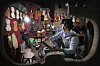 Luthier Kim Sin-seok works on making fusion musical instruments at his studio Shema String, located in Seocho-dong, southern Seoul. [PARK SANG-MOON]