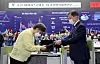 President Moon Jae-in, right, presents Jung Eun-kyeong with a certificate of appointment as the first head of the Korea Disease Control and Prevention Agency during a ceremony held at the emergency situation center of the Korea Centers for Disease Control and Prevention in Cheongju, North Chungcheong, on Friday. Instead of following the tradition of inviting Chung to the Blue House for the appointment ceremony, Moon made a rare visit to her office to present the certificate in an apparent expression of appreciation for her dedicated service during the country's battle against Covid-19. [YONHAP]