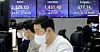 Electronic display boards at Hana Bank in central Seoul show stock and foreign exchange markets Tuesday. [NEWS1]