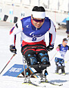 Shin Eui-hyun competes in the para cross-country skiing men's sprint sitting competition at Zhangjiakou National Biathlon Centre in Zhangjiakou, China on Wednesday. [NEWS1]