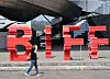 A passerby walks across the Busan International Film Festival (BIFF) logo in front of the Busan Cinema Center in Haeundae District, eastern Busan, on Monday. [YONHAP]