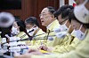 Finance Minister Hong Nam-ki, third from left, speaks during the government meeting held in Seoul on Thursday. [YONHAP]