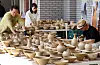 Staff at Yeoju Ceramic Festival organize ceramic pieces on Sunday afternoon. The festival, celebrating its 36th edition since its founding in 1990, acknowledges and showcases the beauty of ceramic pieces through various programs and exhibitions. [NEWS1]