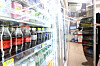 A customer picks out a beverage at a convenience store in Seoul on Monday. [YONHAP]
