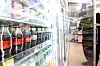 A customer picks out a beverage at a convenience store in Seoul on Monday. [YONHAP]