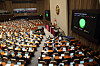 Lawmakers pass a bill with bipartisan support requiring medical institutions to report the birth of newborn babies to local governments in a plenary session of the National Assembly in Yeouido, western Seoul, on Friday, in response to calls for a revision in the law to prevent unregistered births. [NEWS1]