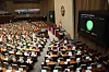 Lawmakers pass a bill with bipartisan support requiring medical institutions to report the birth of newborn babies to local governments in a plenary session of the National Assembly in Yeouido, western Seoul, on Friday, in response to calls for a revision in the law to prevent unregistered births. [NEWS1]