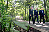From right, Korean President Yoon Suk Yeol, U.S. President Joe Biden and Japanese Prime Minister Fumio Kishida take a walk together after their trilateral summit at Camp David in Maryland on Friday. [AP/YONHAP]