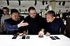 Samsung Electronics President Roh Tae-moon, far left, shows off the Galaxy S23 devices to Qualcomm CEO Cristiano Amon, center, and Google Senior Vice President Hiroshi Lockheimer during its Unpacked event in San Francisco on February 1, 2023. [REUTERS/YONHAP]