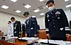 In this file photo at a National Assembly hearing on June 9, 2021, military leaders pray a silent prayer for an Air Force officer who committed suicide after reporting sexual harassment by her colleague. Defense Minister Suh Wook is second from right. [YONHAP]