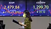 Electronic display boards at Hana Bank in central Seoul shows the Kospi closing at 2,479.84 points and the won at 1,299.70 to the dollar on Thursday. [YONHAP]