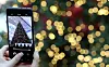 A visitor to the Hyundai Seoul in Yeouido, western Seoul, takes a photo of a Christmas tree set up at the department store on Dec. 11. [YONHAP]