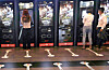 Visitors buy tickets at automated ticket booths in a cinema in Seoul on July 19. [YONHAP]
