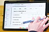 A person tests the prototype of an AI textbook at an edtech fair held in Gangnam District, southern Seoul, in September. [YONHAP]