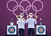 An San, left, and Kim Je-deok hold up their archery mixed team gold medals on the podium on July 24 at Yumenoshima Park Archery Field in Tokyo. [YONHAP]