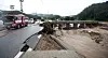 A road in Chungju, North Chungcheong, one of the areas worst affected by the weekend's rains, lies damaged on Sunday. [YONHAP]