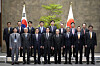 Japanese Prime Minister Fumio Kishida, pictured fourth left in front, Korea-Japan Economic Association Chairman Kim Yoon, third left in front, and his counterpart Mikio Sasaki, on Kishida's right, pose for a photo at Kishida's office in Tokyo on Monday. [AP/YONHAP]