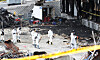 Police forensic investigators on Sunday search for missing remains of victims killed by a warehouse fire in Icheon, Gyeonggi, last week. [YONHAP]