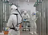 Medical workers in protective gear work at an intensive care unit at Osan Hankook Hospital, a medical facility only for Covid-19 patients in Osan, Gyeonggi, on Wednesday. [NEWS1]