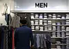 A customer looks at men's clothing on display at a discount mart in Seoul, Wednesday. As Covid-19 begins to wane and the government is looking to ease social distancing rules, demand for men's suits increased 21.1 percent from March 1 to April 10 compared to the same period last year, according to Shinsegae Department Store. [YONHAP]