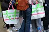 Tourists carry Olive Young's tarpaulin reusable bag in Myeongdong, central Seoul. [CHO YONG-JUN]