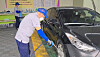 Elderly employees at car wash Hyo in the basement of Yongin City Hall in Gyeonggi washing cars. [CHAE HYE-SEON]
