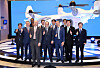 A Bureau International des Expositions delegation and Busan Mayor Park Heong-joon pose with an urban air mobility (UAM) vehicle after having a virtual tour of the North Port on Wednesday at the Busan Port International Exhibition & Convention Center. [YONHAP]
