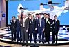 A Bureau International des Expositions delegation and Busan Mayor Park Heong-joon pose with an urban air mobility (UAM) vehicle after having a virtual tour of the North Port on Wednesday at the Busan Port International Exhibition & Convention Center. [YONHAP]