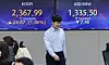Screens in Hana Bank's trading room in central Seoul show stock and foreign exchange markets open on Friday. [YONHAP]