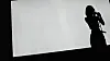 Teaser image only showing the silhouette of a member of JYP's upcoming girl group. [JYP ENTERTAINMENT]