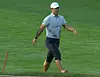 Tom Kim emerges from the creek at the Oak Hill Country Club in Rochester, New York on Thursday. [SCREEN CAPTURE]