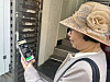 Choi Seoung-hee, a 66-year-old 'N-jobber' from Dongdaemun District in eastern Seoul, recently looks at the phone she uses when working. N-jobbers refer to a person who holds an ″N″ number of jobs. [SEOUL METROPOLITAN GOVERNMENT]