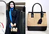 First lady Kim Keon-hee carries a Harlie K purse when boarding the Air Force One departing for UAE on Jan. 14 at Seoul Air Base for a state visit. [YONHAP, HARLIE K]