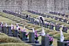 A young elementary student sits in front of the tomb of someone who fell during the April Revolution of 1960 at the April 19th National Cemetery in Suyu-dong, Gangbuk District, northern Seoul, Tuesday. The revolution, often simply referred to as April 19, was a protest movement against Korea’s first president Syngman Rhee, who resigned as a result of the uprising. The protests started when the body of a high school student, who was killed by the police while demonstrating against a rigged election, was found. Some 186 people lost their lives during the movement. [YONHAP]
