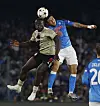 Ajax's Brian Brobbey, left, in action with Napoli's Kim Min-jae during a Champions League game in Naples on Wednesday. [REUTERS/YONHAP]