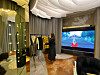 An employee organizes clothes hung on the rack at a personal shopping space for VIP customers, at Avenuel of Lotte Tower. [LOTTE DEPARTMENT STORE]