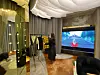 An employee organizes clothes hung on the rack at a personal shopping space for VIP customers, at Avenuel of Lotte Tower. [LOTTE DEPARTMENT STORE]