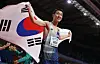 Woo Sang-hyeok celebrates after winning gold in the men's high jump final at the World Athletics Indoor Championships at Stark Arena in Belgrade, Serbia on Sunday. [REUTERS/YONHAP]