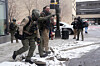 A person who was chased by a group is removed by law enforcement officers after an anti-Islam demonstration led by a right-wing activist ended in Minneapolis on Jan. 17. [REUTERS/YONHAP]