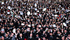 Graduates of the College of Maritime Sciences at the National Korea Maritime & Ocean University in Busan toss their caps at their graduation ceremony on Wednesday. The school has the earliest graduation in the country as male students need to undergo a month of military training between completing their studies and boarding ships. [YONHAP]