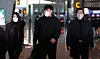 Ryu Hyun-jin, center, arrives at Incheon International Airport on Wednesday before flying to Florida to begin spring training. [YONHAP]