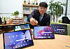 An employee examines tablets at the Sejong government complex on the morning of Feb. 4. [YONHAP]