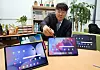 An employee examines tablets at the Sejong government complex on the morning of Feb. 4. [YONHAP]