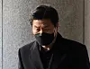 Former Yongsan Police Station chief Lee Im-jae arrives at the Seoul Western District Court to attend his arrest warrant hearing on Friday. [YONHAP]
