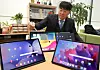 An employee examines tablets at the Sejong government complex on the morning of Feb. 4. [YONHAP]